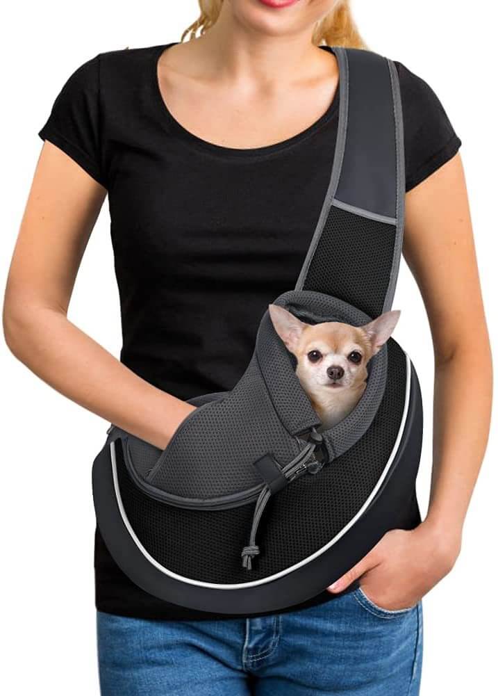 Carrying Pets Bag Women Outdoor Portable Crossbody Bag For Dogs Cats Pet Products with a small dog in it.